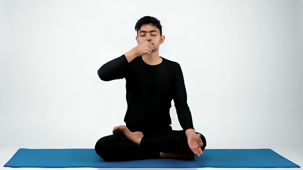 Anulom Vilom Pranayama, often referred to as "alternate nostril breathing," is a breathing technique that balances your mind, body, and soul. It involves inhaling through one nostril and exhaling through the other, in a specific pattern. This helps regulate your breathing, calm your mind, and improve your overall well-being.