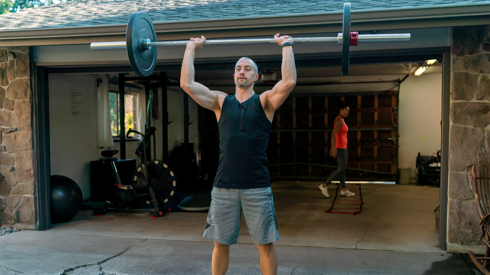 The push press may seem the same as your usual overhead press at face value, but that extra momentum from the legs is really a game-changer. The movement not only ignites the shoulders but also gets your legs, core, and upper back into action.